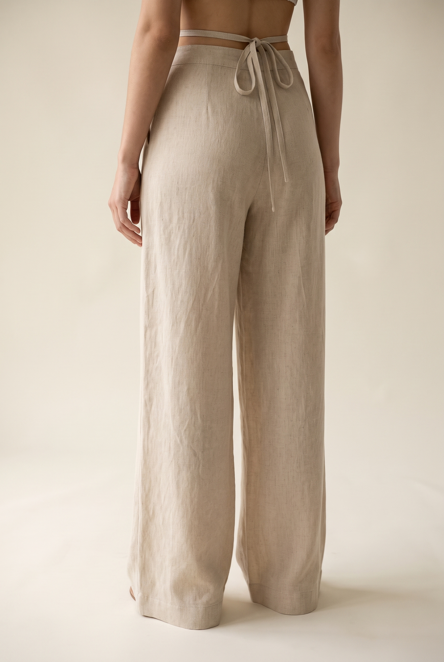 Beige linen pants, back view