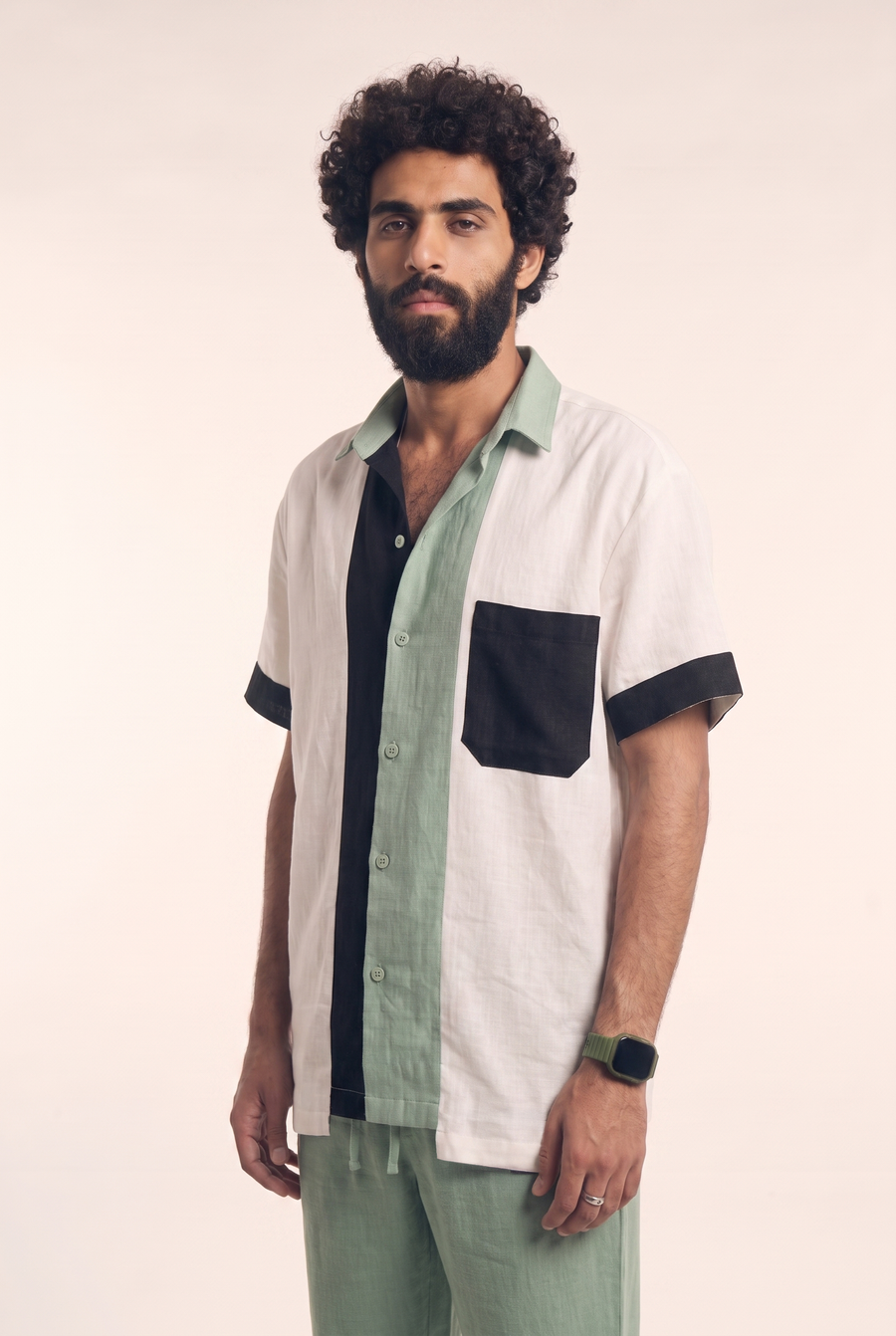 Offwhite, mint green and black linen button-up, side flat lay