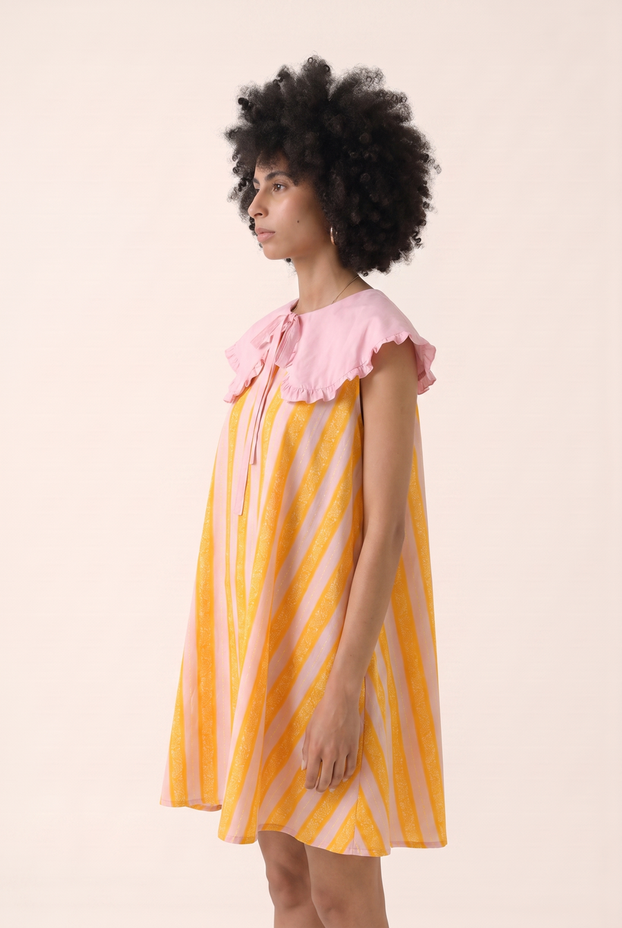 Orange Dune midi dress, alternate view of the pleated silhouette.