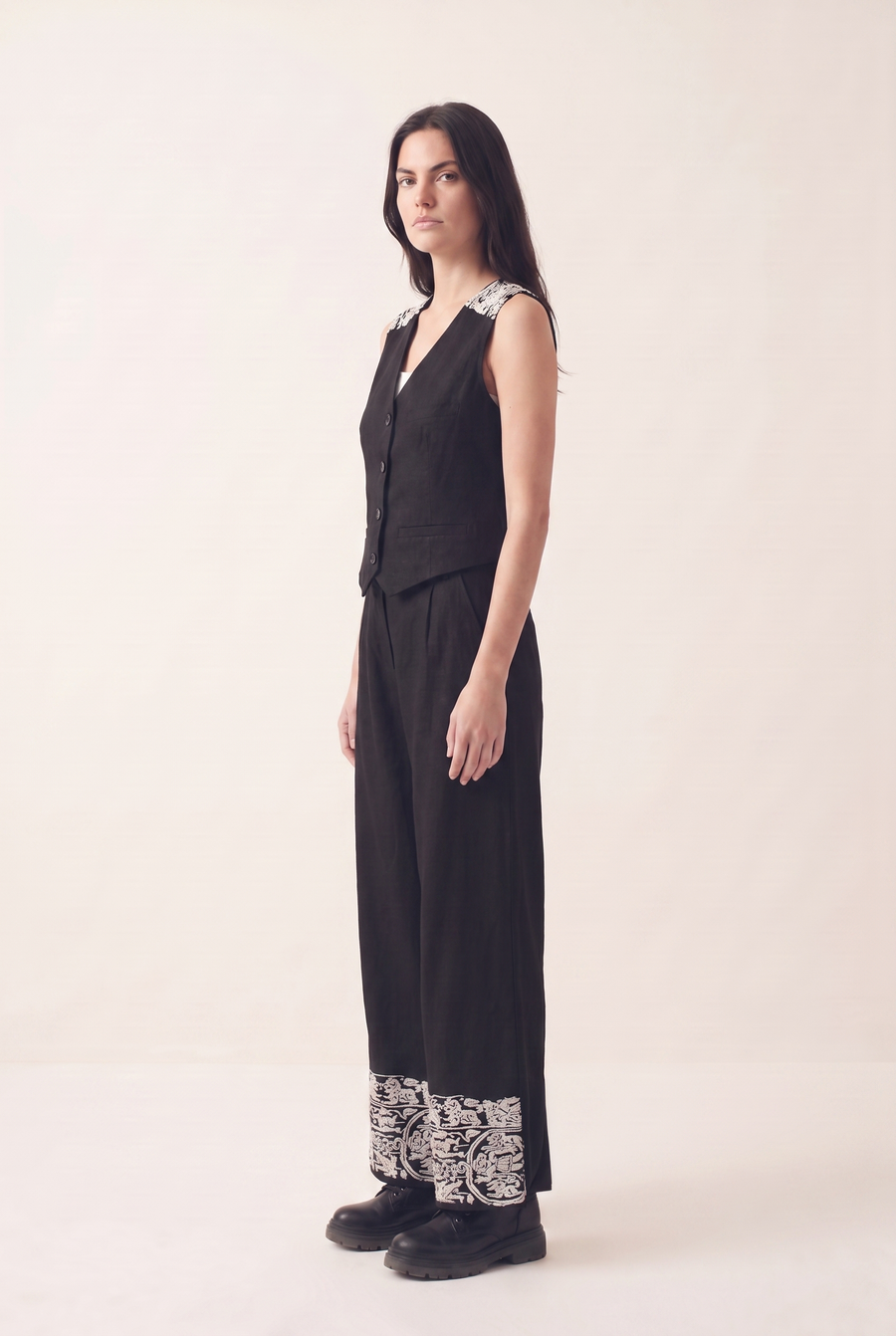Black oversized embroidered pants, side view