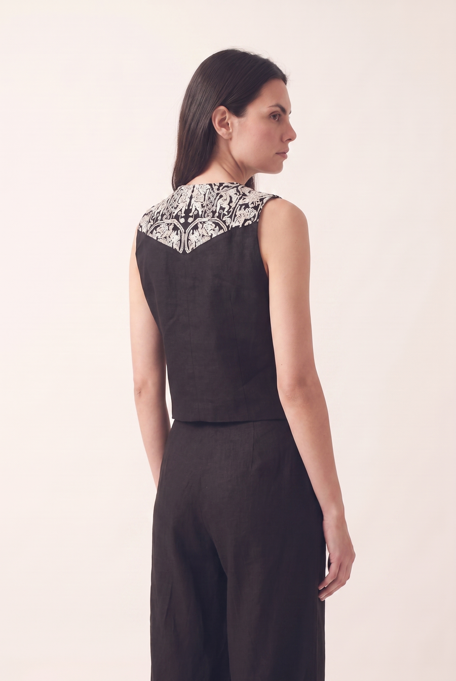 Black oversized embroidered vest, back view
