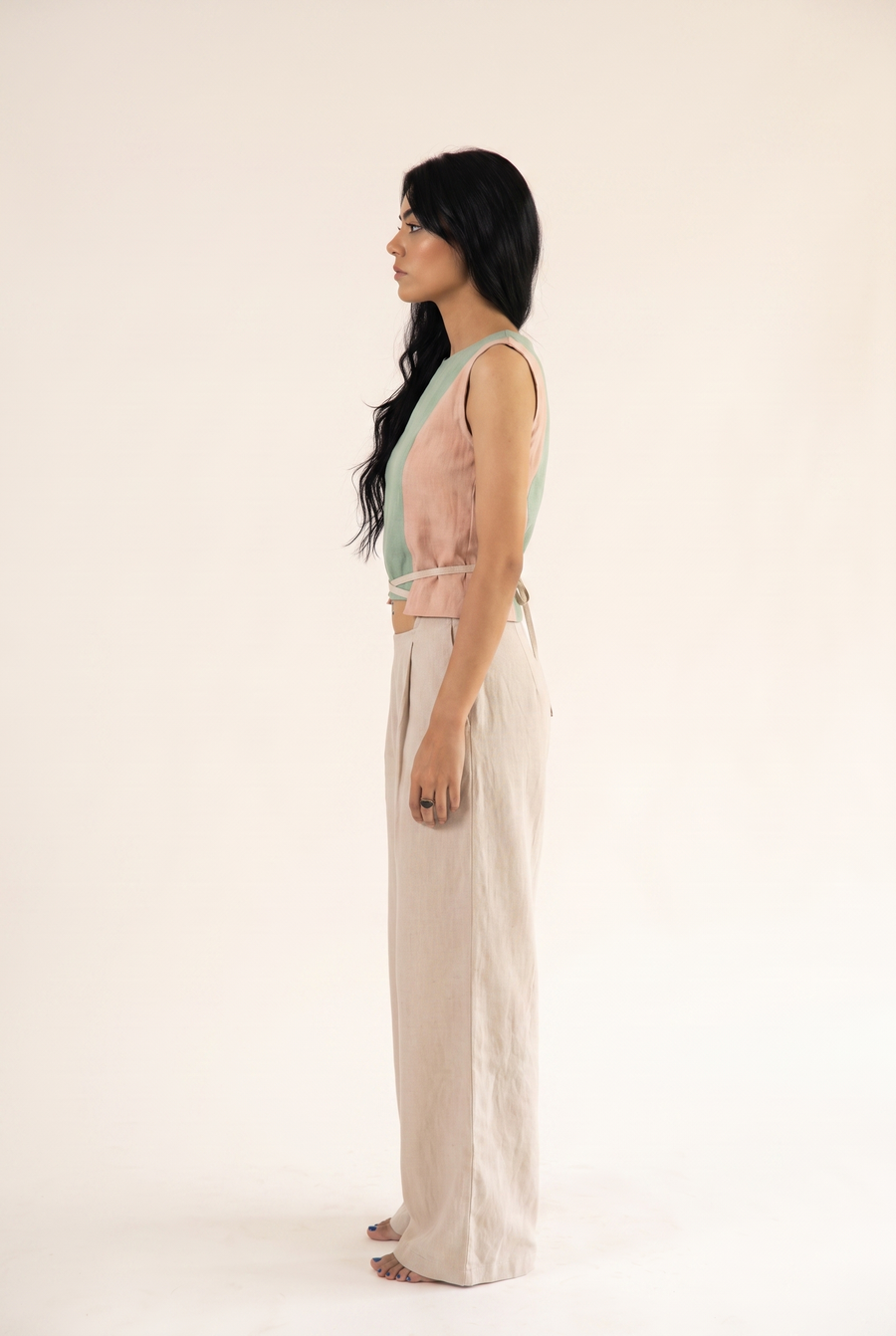 Beige and mint green linen top, side view