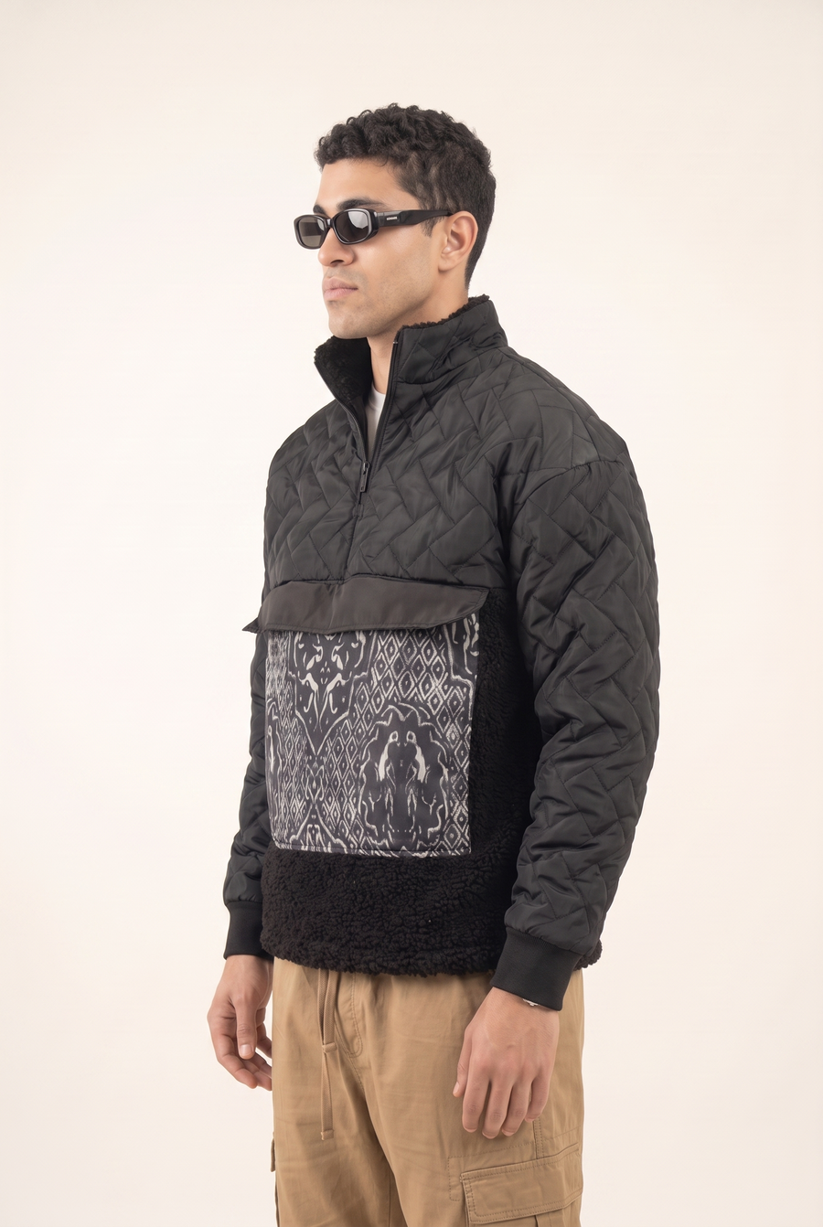 Black sweatshirt with Islamic art pocket design, side view.