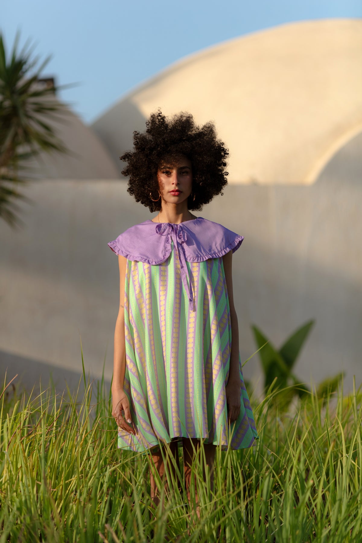 Blue Dune midi dress worn, styled view.