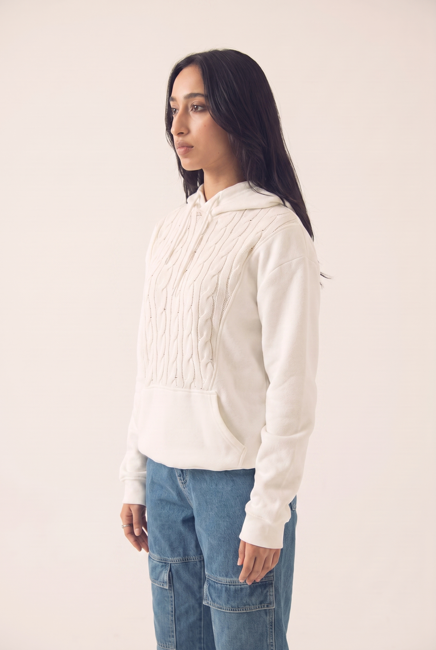 White hoodie with braided detailing, side view