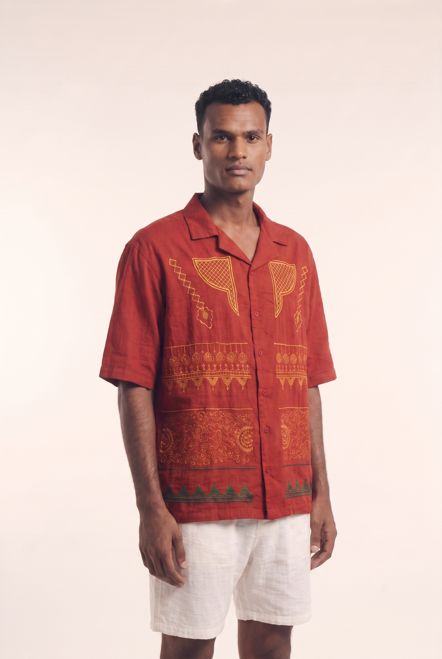 Maroon Nubian button-up shirt, side view showing the tailored silhouette.