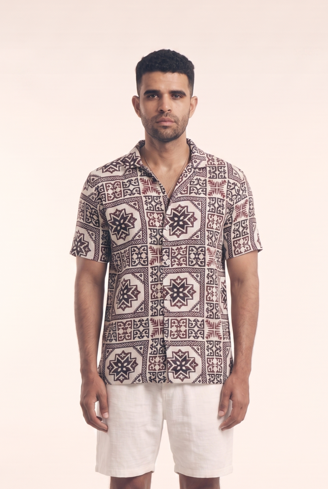 Beige button-up shirt with Arabisk pattern, front flat lay
