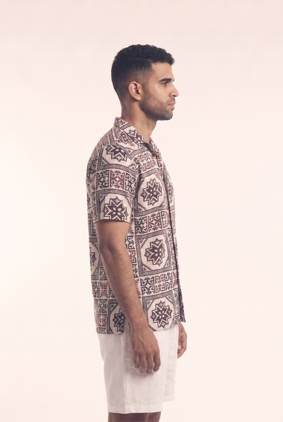 Beige button-up shirt with Arabisk pattern, side flat lay