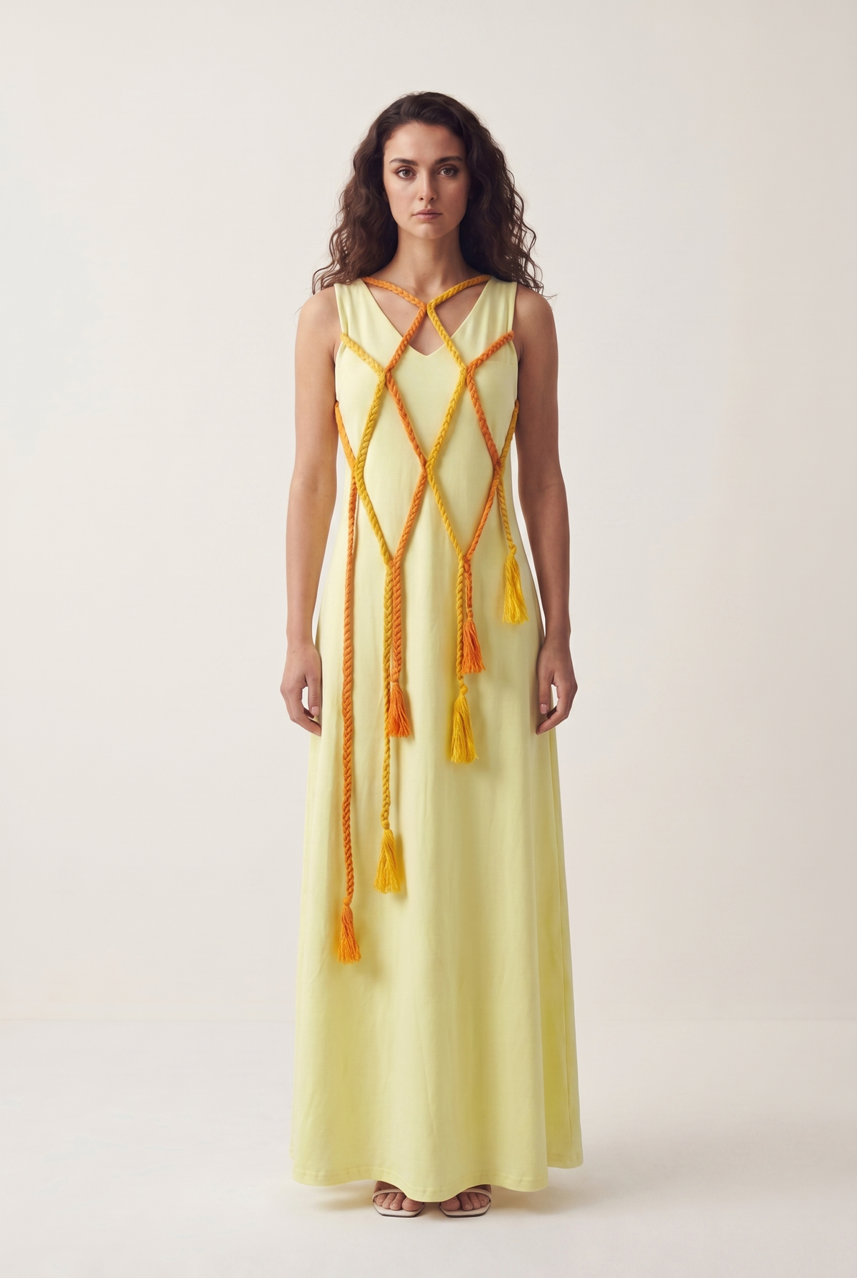 Morning Bride Dress in pale yellow Egyptian cotton with a braided orange rope harness across the bodice, front view