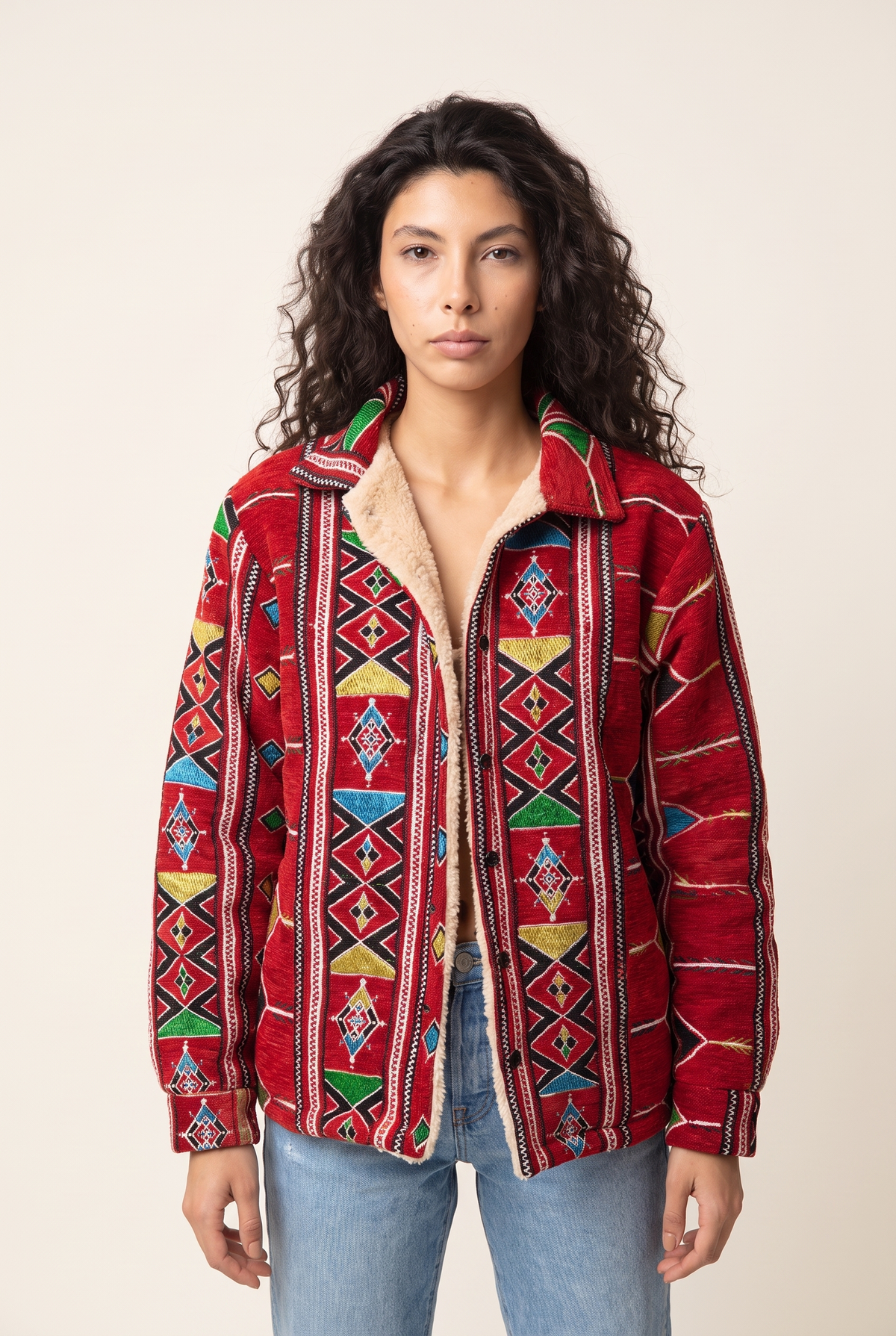 Red Nubie Flame Jacket with Nubian rug-inspired pattern, front view.