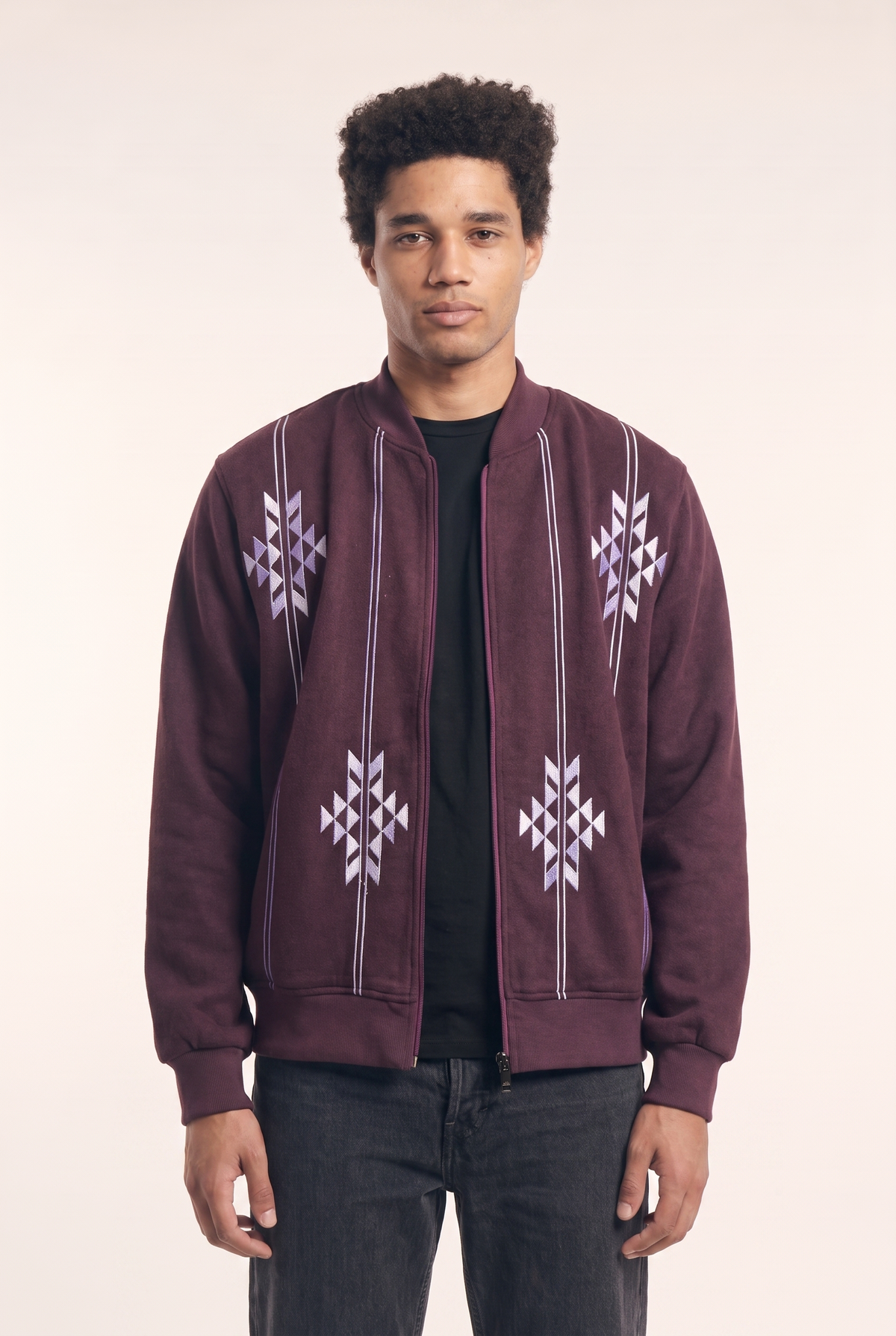 Burgundy Nubie Knight jacket with Nubian-inspired embroidery, front view.