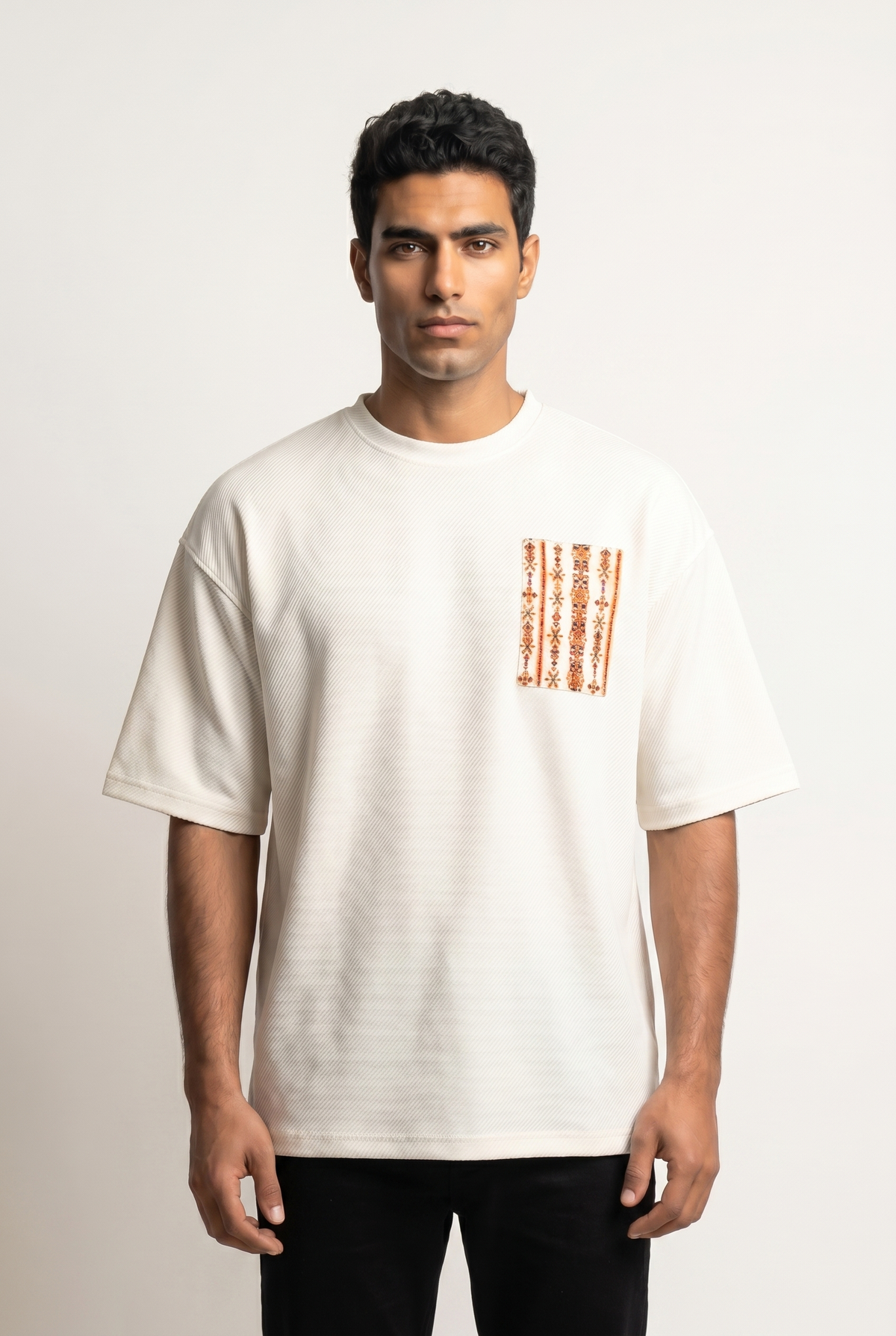 White Siwi Stitches Tshirt with embroidered chest pocket in Siwan geometric pattern, front view