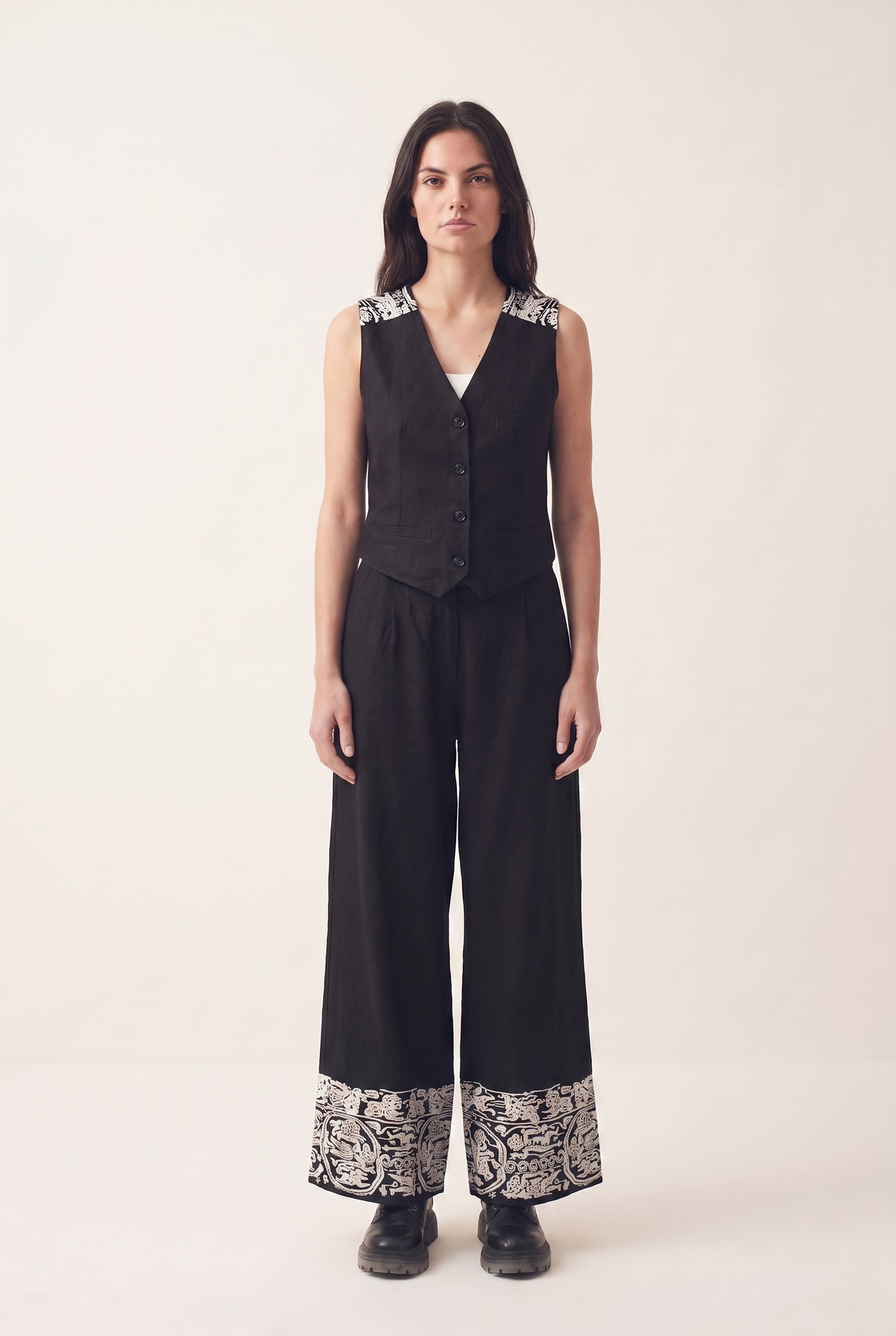 Black oversized embroidered pants, front view